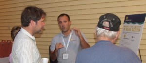 Manager Jeremy Poste (centre) explains tidal project at open house last fall